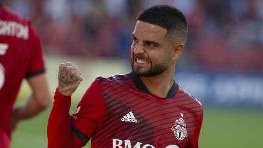 Toronto FC's Lorenzo Insigne celebrates after Michael Bradley scored against Charlotte FC during the first half of an MLS soccer match Saturday, July 23, 2022, in Toronto. (Chris Young/The Canadian Press via AP)