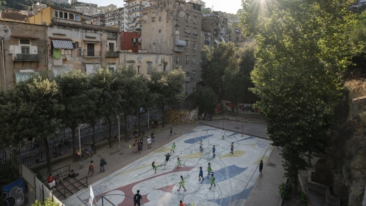 Spartak San Gennaro team training on a concrete field in Naples.