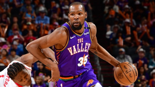 Kevin Durant #35 of the Phoenix Suns drives to the basket during the game against the Houston Rockets on March 30, 2025 at PHX Arena in Phoenix, Arizona.
