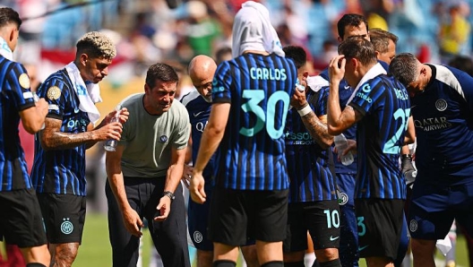 Head Coach Cristian Chivu of FC Internazionale talks with players during a match.