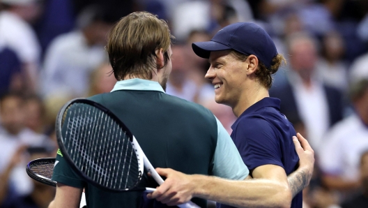 Jannik Sinner shakes hands with Alexander Bublik after their US Open match.
