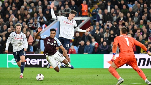 Ollie Watkins of Aston Villa is fouled by Martin Vitik of Bologna FC 1909
