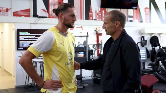 Adrien Rabiot and Massimiliano Allegri talking during an AC Milan Training Session at Milanello