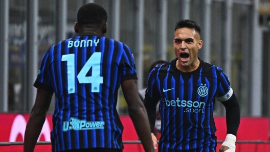 Lautaro Martinez celebrates with Ange-Yoan Bonny after scoring for Inter Milan