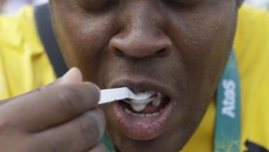 Jamaican athletics competitor O'Dayne Richard eats an ice cream sundae at Athletes Village at the 2016 Summer Olympics in Rio de Janeiro, Brazil, Thursday, Aug. 4, 2016. (AP Photo/Robert F. Bukaty)