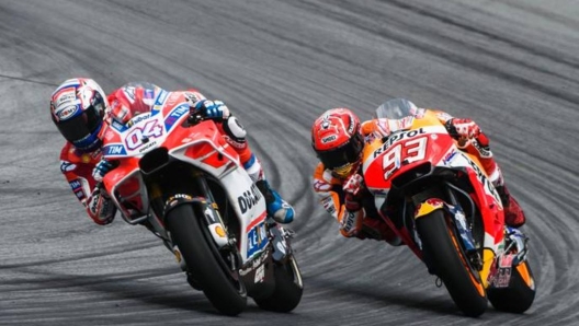 Gp Austria Motogp Ducati Team's Italian rider Andrea Dovizioso (L) and Repsol Honda Team's Spanish rider Marc Marquez compete during the MotoGP Austrian Grand Prix race at Red Bull Ring in Spielberg, Austria on August 13, 2017. / AFP PHOTO / Jure Makovec