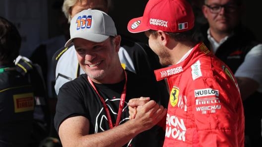 Rubens Barrichello con Sebastian Vettel. Lapresse