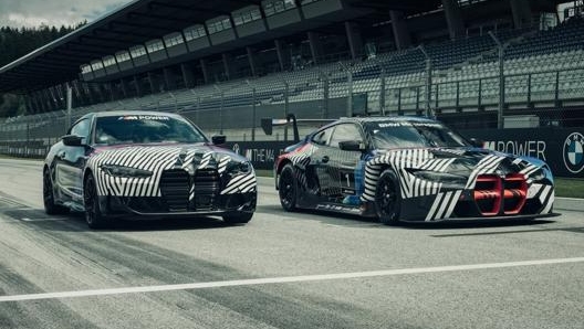 La nuova Bmw M4 Coupé sulla linea di partenza del Red Bull Ring accanto alla versione da corsa M4 Gt3