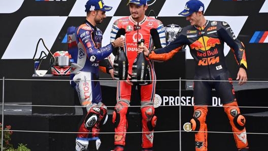 Il podio del GP di Stiria, con Miguel Oliveira, Jack Miller e Pol Espargaro. Afp