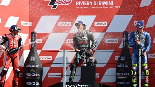 Pecco Bagnaia, Franco Morbidelli e Joan Mir sul podio di Misano il 14 settembre dello scorso anno. Afp