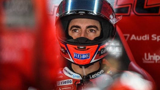 Ducati Italian rider Francesco Bagnaia sits in the box during the first MotoGP free practice session of the Portuguese Grand Prix at the Algarve International Circuit in Portimao on November 5, 2021. (Photo by PATRICIA DE MELO MOREIRA / AFP)