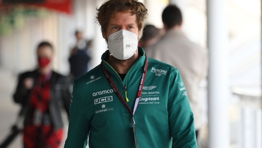 Aston Martin's German driver Sebastian Vettel arrives for a press conference during the second day of the Formula One (F1) pre-season testing at the Circuit de Barcelona-Catalunya in Montmelo, Barcelona province, on February 24, 2022. (Photo by LLUIS GENE / AFP)