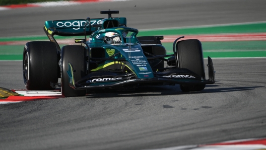 TOPSHOT - Aston Martin's German driver Sebastian Vettel drives during the first day of the Formula One (F1) pre-season testing at the Circuit de Barcelona-Catalunya in Montmelo, Barcelona province, on February 23, 2022. (Photo by LLUIS GENE / AFP)