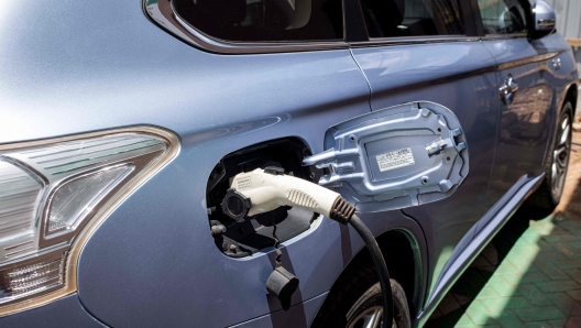 A car is charged at a charging station in Nairobi on February 19, 2022. - The company is so far the only one providing charging stations for private vehicles with four around Nairobi. The East African nation is trying to speed uptake of electric vehicles (EVs) as part of the National Climate Change Action Plan 2018-2022 as more companies try to get a share of a growing market and turn the country into a hub for Evs in the continent. The government is planning on lowering import duty for EVs while the national electric company Kenya Power has already unveiled plans to install charging stations across the country hoping to remove one of the biggest obstacles in owning an electric vehicle. It is estimated that there are about 350 EVs registered in Kenya out of a total of 3.5 million. The company is so far the only one providing charging stations for private vehicles around Nairobi with four in total. The East African nation is trying to speed uptake of electric vehicles (EVs) as part of the National Climate Change Action Plan 2018-2022 as more companies try to get a share of a growing market and turn the country into a hub for Evs in the continent. The government is planning on lowering import duty for EVs while the national electric company Kenya Power has already unveiled plans to install charging stations across the country hoping to remove one of the biggest obstacles in owning an electric vehicle. It is estimated that there are about 350 EVs registered in Kenya out of a total of 3.5 million. (Photo by Patrick Meinhardt / AFP)