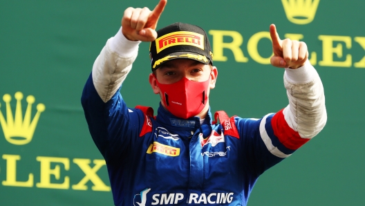 SPA, BELGIUM - AUGUST 30: Race winner Robert Shwartzman of Russia and Prema Racing celebrates on the podium during the sprint race of the Formula 2 Championship at Circuit de Spa-Francorchamps on August 30, 2020 in Spa, Belgium. (Photo by Bryn Lennon/Getty Images)