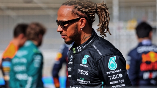 Mercedes' British driver Lewis Hamilton walks during the first day of Formula One (F1) pre-season testing at the Bahrain International Circuit in the city of Sakhir on March 12, 2021. (Photo by Giuseppe CACACE / AFP)