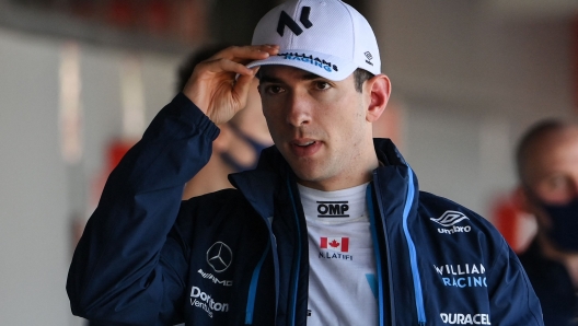 Williams' Canadian driver Nicholas Latifi arrives for a press conference during the first day of the Formula One (F1) pre-season testing at the Circuit de Barcelona-Catalunya in Montmelo, Barcelona province, on February 23, 2022. (Photo by LLUIS GENE / AFP)