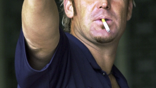 FILE - Australia's Shane Warne gestures during the fifth day of the second cricket test match between India and Australia in Madras, India, Monday, Oct. 18, 2004. The second cricket test between India and Australia ended in a draw Monday as rain-washed out the entire last days play. Shane Warne, one of the greatest cricket players in history, has died. He was 52. Fox Sports television, which employed Warne as a commentator, quoted a family statement as saying he died of a suspected heart attack in Koh Samui, Thailand. (AP Photo/M. Lakshman, File)