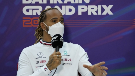 Mercedes driver Lewis Hamilton of Britain speaks during a press conference at the Formula One Bahrain International Circuit in Sakhir, Bahrain, Friday, March 18, 2022. The Bahrain Formula One Grand Prix will take place here on Sunday. (AP Photo/Hassan Ammar)