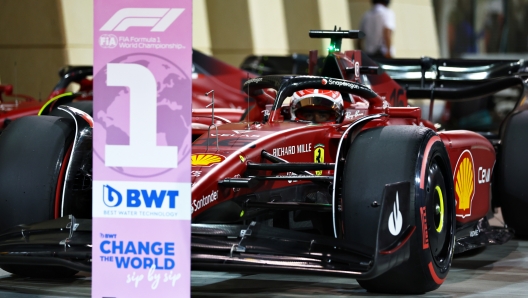 BAHRAIN, BAHRAIN - MARCH 19: Pole position qualifier Charles Leclerc of Monaco and Ferrari stops in parc ferme during qualifying ahead of the F1 Grand Prix of Bahrain at Bahrain International Circuit on March 19, 2022 in Bahrain, Bahrain. (Photo by Lars Baron/Getty Images)