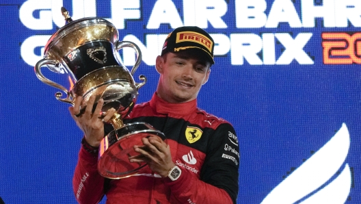 Ferrari driver Charles Leclerc of Monaco celebrates after he won the Formula One Bahrain Grand Prix it in Sakhir, Bahrain, Sunday, March 20, 2022. (AP Photo/Hassan Ammar)