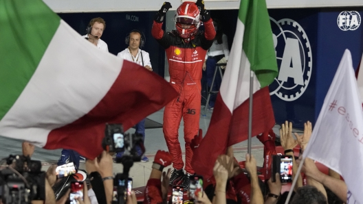 Ferrari driver Charles Leclerc of Monaco celebrates after he won the Formula One Bahrain Grand Prix it in Sakhir, Bahrain, Sunday, March 20, 2022. (AP Photo/Hassan Ammar)