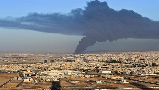 Smoke billows from an oil storage facility in Saudi Arabia's Red Sea coastal city of Jeddah on March 25, 2022. (Photo by ANDREJ ISAKOVIC / AFP)