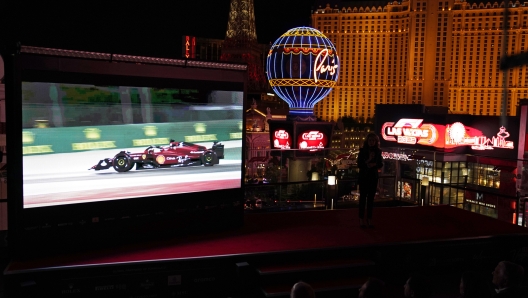 A screen show Charles Leclerc driving a Ferrari, during a news conference announcing a 2023 Formula One Grand Prix auto race to be held in Las Vegas, Wednesday, March 30, 2022, in Las Vegas. (AP Photo/John Locher)