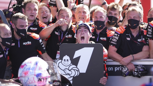 Spanish rider Aleix Espargaro of Aprilia Racing, center, celebrates winning the MotoGP race at the circuit in Termas de Rio Hondo, Argentina, Sunday, April 3, 2022. (AP Photo/Nicolas Aguilera)