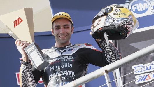 AUSTIN, TEXAS - APRIL 09: Danilo Petrucci of Italy and Warhorse HSBK Racing Ducati New York team celebrates the victory on the podium at the end of the race of the AMA MotoAmerica SuperBike during the MotoGP Of The Americas - Qualifying on April 09, 2022 in Austin, Texas.   Mirco Lazzari gp/Getty Images/AFP == FOR NEWSPAPERS, INTERNET, TELCOS & TELEVISION USE ONLY ==