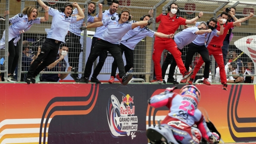 Enea Bastianini (23), of Italy, celebrates with his team as he wins the MotoGP Grand Prix of the Americas motorcycle race at the Circuit of the Americas, Sunday, April 10, 2022, in Austin, Texas. (AP Photo/Eric Gay)