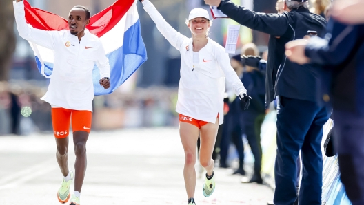 Dutch Abdi Nageeye (L) and Dutch Nienke Brinkman (R) celebrate at the end of the 41th edition of the Rotterdam Marathon in Rotterdam, on April 10, 2022. (Photo by Koen van Weel / ANP / AFP) / Netherlands OUT