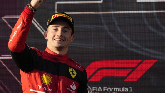 epa09881801 Monaco's Formula One driver Charles Leclerc of Scuderia Ferrari celebrates on the podium after winning the Formula One Grand Prix of Australia at Albert Park Circuit in Melbourne, Australia, 10 April 2022.  EPA/SIMON BAKER