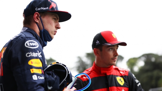 IMOLA, ITALY - APRIL 22: Pole position qualifier Max Verstappen of the Netherlands and Oracle Red Bull Racing (L) and Second placed qualifier Charles Leclerc of Monaco and Ferrari (R) look on in parc ferme during qualifying ahead of the F1 Grand Prix of Emilia Romagna at Autodromo Enzo e Dino Ferrari on April 22, 2022 in Imola, Italy. (Photo by Dan Mullan/Getty Images)