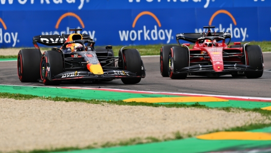 IMOLA, ITALY - APRIL 23: Max Verstappen of the Netherlands driving the (1) Oracle Red Bull Racing RB18 overtakes Charles Leclerc of Monaco driving (16) the Ferrari F1-75 for the lead during Sprint ahead of the F1 Grand Prix of Emilia Romagna at Autodromo Enzo e Dino Ferrari on April 23, 2022 in Imola, Italy. (Photo by Dan Mullan/Getty Images)