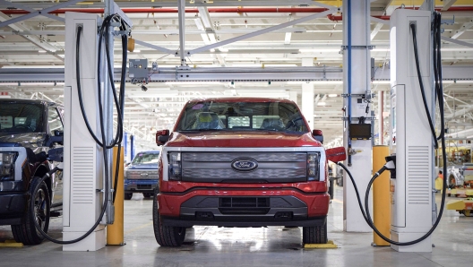 This handout photo released by Ford Motor Company on April 26, 2022 shows the F-150 Lightning at a charging station in the Rouge Electric Vehicle Center in Dearborne, Michighan. - Today marks the launch of the all-new, electric F-150 Lightning pickup  a milestone moment in Americas shift to electric vehicles. (Photo by FORD MOTOR COMPANY / AFP) / RESTRICTED TO EDITORIAL USE - MANDATORY CREDIT "AFP PHOTO / FORD Motor Company  / HANDOUT " - NO MARKETING - NO ADVERTISING CAMPAIGNS - DISTRIBUTED AS A SERVICE TO CLIENTS