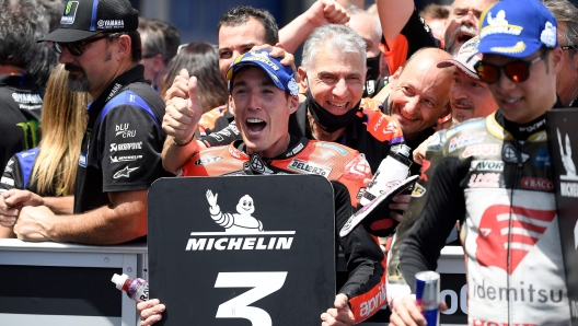 Aprilia Spanish rider Aleix Espargaro celebrates after placing third during the MotoGP race of the Spanish Grand Prix at the Jerez racetrack in Jerez de la Frontera on May 1, 2022. (Photo by JORGE GUERRERO / AFP)