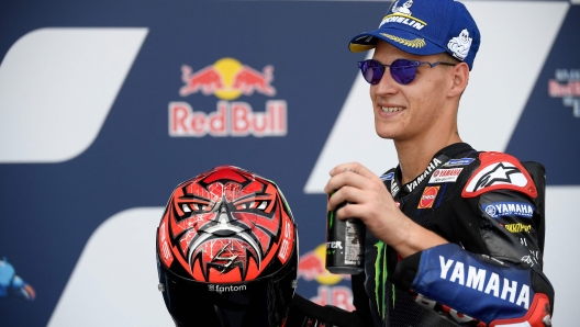 Yamaha French rider Fabio Quartararo celebrates on the podium after the MotoGP race of the Spanish Grand Prix at the Jerez racetrack in Jerez de la Frontera on May 1, 2022. (Photo by JORGE GUERRERO / AFP)