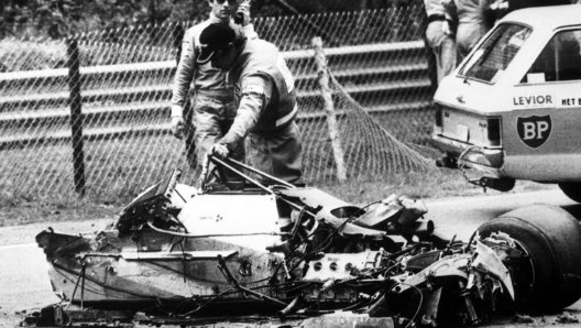 Racing track officials looking at the remains of the Ferrari of Canadian racing driver Gilles Villeneuve during the final qualifying session for the Belgian Grand Prix at Zolder on May 8, 1982. Villeneuve's car touched the rear wheel of Jochen Mass's car, flew in the air and crashed nose first into a sandbank. Villeneuve was pronounced dead on arrival at the hospital. (AP Photo/Heinz Ducklau)