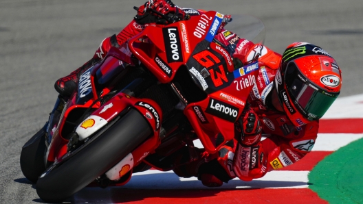 epa09993591 Italian MotoGP rider Francesco Bagnaia of Aprilia team takes a bend during a free practice for the Catalonia Grand Prix race at Circuit de Barcelona-Catalunya track, in Montmelo, Barcelona, northeastern Spain, 03 July 2022. The Motorcycling Grand Prix of Catalonia will take place on 05 June 2022.  EPA/ENRIC FONTCUBERTA