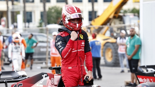 Ferrari driver Charles Leclerc of Monaco celebrates after setting the pole position in the qualifying session at the Baku circuit, in Baku, Azerbaijan, Saturday, June 11, 2022. The Formula One Grand Prix will be held on Sunday. (Hamad Mohammed, Pool Via AP)