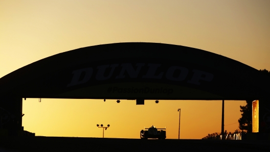 LE MANS, FRANCE - JUNE 12: The #34 Inter Europol Competition Oreca 07 - Gibson of Jakub Smiechowski, Renger Van der Zande, and Alex Brundle drives under the Dunlop Bridge at sunrise during the 24 Hours of Le Mans at the Circuit de la Sarthe on June 12, 2022 in Le Mans, France. (Photo by Ker Robertson/Getty Images)