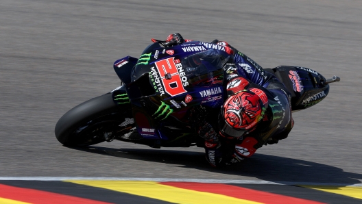 Monster Energy Yamaha's French rider Fabio Quartararo steers his motorbike during the third free practice for the MotoGP German motorcycle Grand Prix at the Sachsenring racing circuit in Hohenstein-Ernstthal near Chemnitz, eastern Germany, on June 18, 2022. (Photo by Ronny Hartmann / AFP)