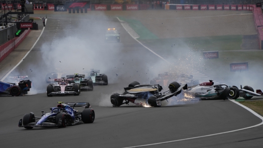 Cars crash at the start of the British Formula One Grand Prix at the Silverstone circuit, in Silverstone, England, Sunday, July 3, 2022. (AP Photo/Frank Augstein)