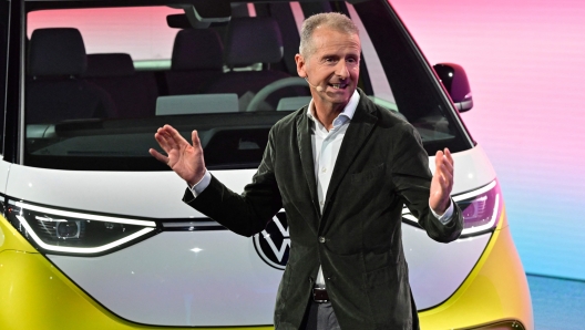 Volkswagen Group chief executive officer Herbert Diess speaks during an event to unveil the new Volkswagen ID Buzz electric van, on March 9, 2022 in Hamburg, northern Germany. - The German automaker unveiled the camper's latest iteration, known as the ID.Buzz, part of the flagship ID line with which Volkswagen is leading a multi-billion-euro charge into the electric car market. (Photo by John MACDOUGALL / AFP)