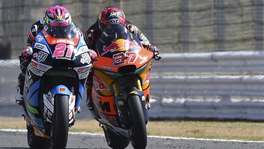 Spain's rider Alonso Lopez of the MB Conveyors Speed Up, left, steers his motorcycle followed by Spain's rider Augusto Fernandez of the Red Bull KTM Ajo during the Moto2 race at the British Motorcycle Grand Prix at the Silverstone racetrack, in Silverstone, England, Sunday, Aug. 7, 2022. (AP Photo/Rui Vieira)