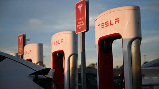 A Tesla, Inc. electric vehicle charges at supercharger location in Hawthorne, California, on August 9, 2022. - Tesla CEO Elon Musk sold 7.92 million shares of Tesla worth around $6.88 billion, according to a series of financial filings published August 9, 2022. His transactions occurred between August 5 and 9, the SEC filings revealed, following Teslas 2022 annual shareholder meeting on August 4 in Austin, Texas. Musk tweeted it was important to avoid an emergency sale of Tesla stock amid a legal showdown with Twitter over a $44 billion takeover deal. Earlier this year, the Tesla and SpaceX CEO said on social media that he had no further TSLA sales planned. (Photo by Patrick T. FALLON / AFP)