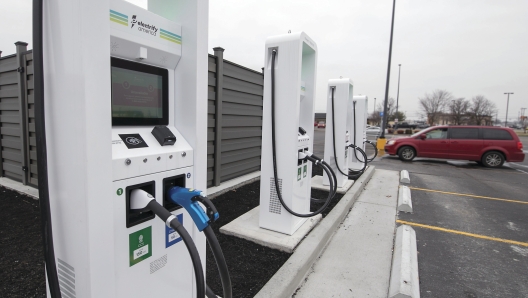 FILE - Electrify America, an electric car charger producer, has opened a charging station Wednesday, Jan. 16, 2019, in Paducah, Ky.  German engineering company Siemens is making an investment in Electrify America, a Volkswagen division that includes a network of electric vehicle charging stations in North America. Electrify America said Tuesday, June 28, 2022,  that Siemens is its first outside investor and will have a board seat. Siemens will contribute a low triple-digit million dollar amount, with media reports pegging it at more than $100 million. (Ellen O'Nan/The Paducah Sun via AP, File)