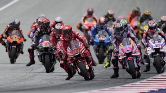 Italy's Francesco Bagnaia rides his Ducati leads at the first lap competes during the Moto GP race as part of the Austrian motorcycle Grand Prix at the Red Bull Ring in Spielberg, Austria, Sunday, Aug. 21, 2022. (AP Photo/Florian Schroetter)