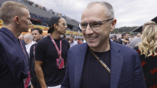 epa10063570 Stefano Domenicali, CEO of the Formula One Group walks on the starting grid ahead of the Formula One Grand Prix of Austria at the Red Bull Ring in Spielberg, Austria, 10 July 2022.  EPA/RONALD WITTEK